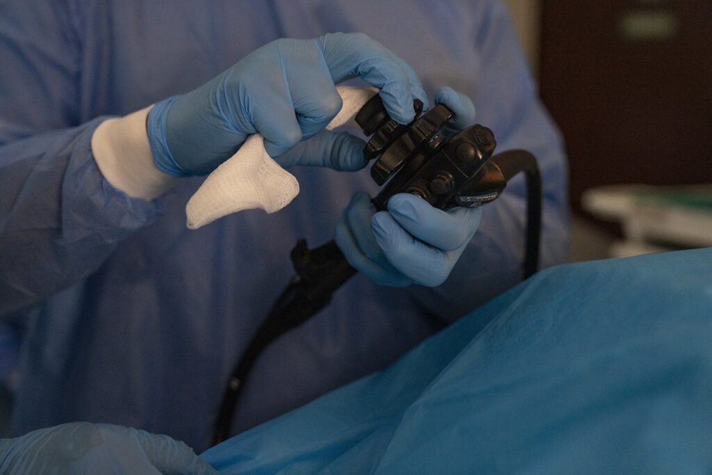 U.S. Air Force Lt. Col. Micheal Brazeau, 88th Healthcare Operations Squadron gastroenterologist, maneuvers an endoscope using the control dials during