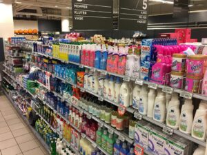 Cleaning products and laundry soaps and detergents aisle in Meny Supermarket at Bergen Stormarked Shopping Mall in Bergen, Norway.